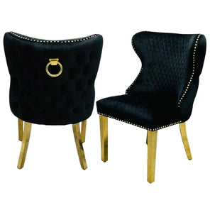 Pair of  Leather buttoned back dining chairs with lions head