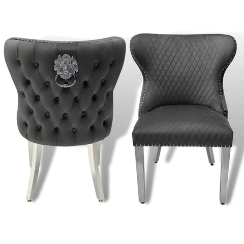 Pair of  Leather buttoned back dining chairs with lions head